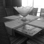 Recycled wood dining table and hand blown glass bowl